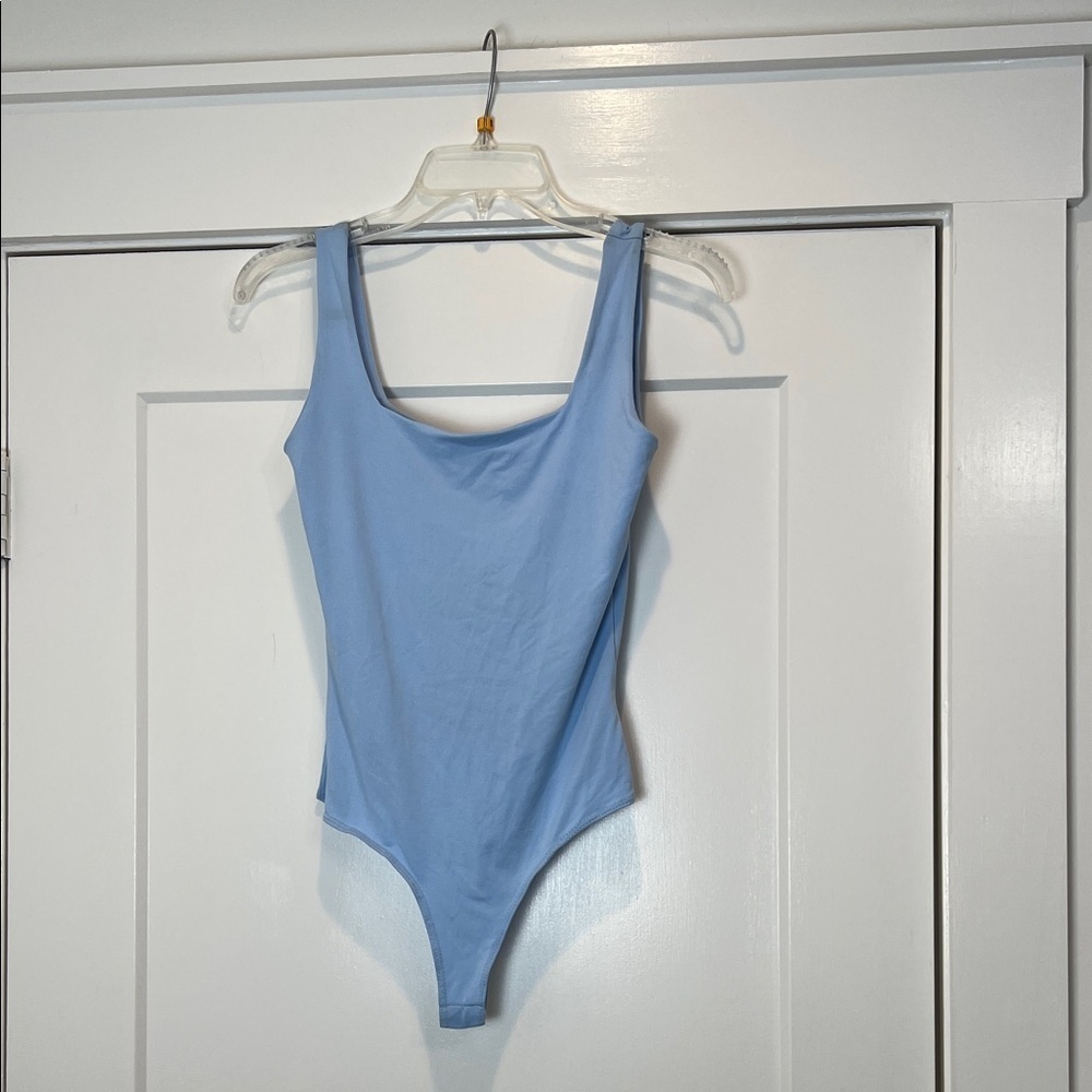 Le Lis Sky Blue Bodysuit size small. NWT!